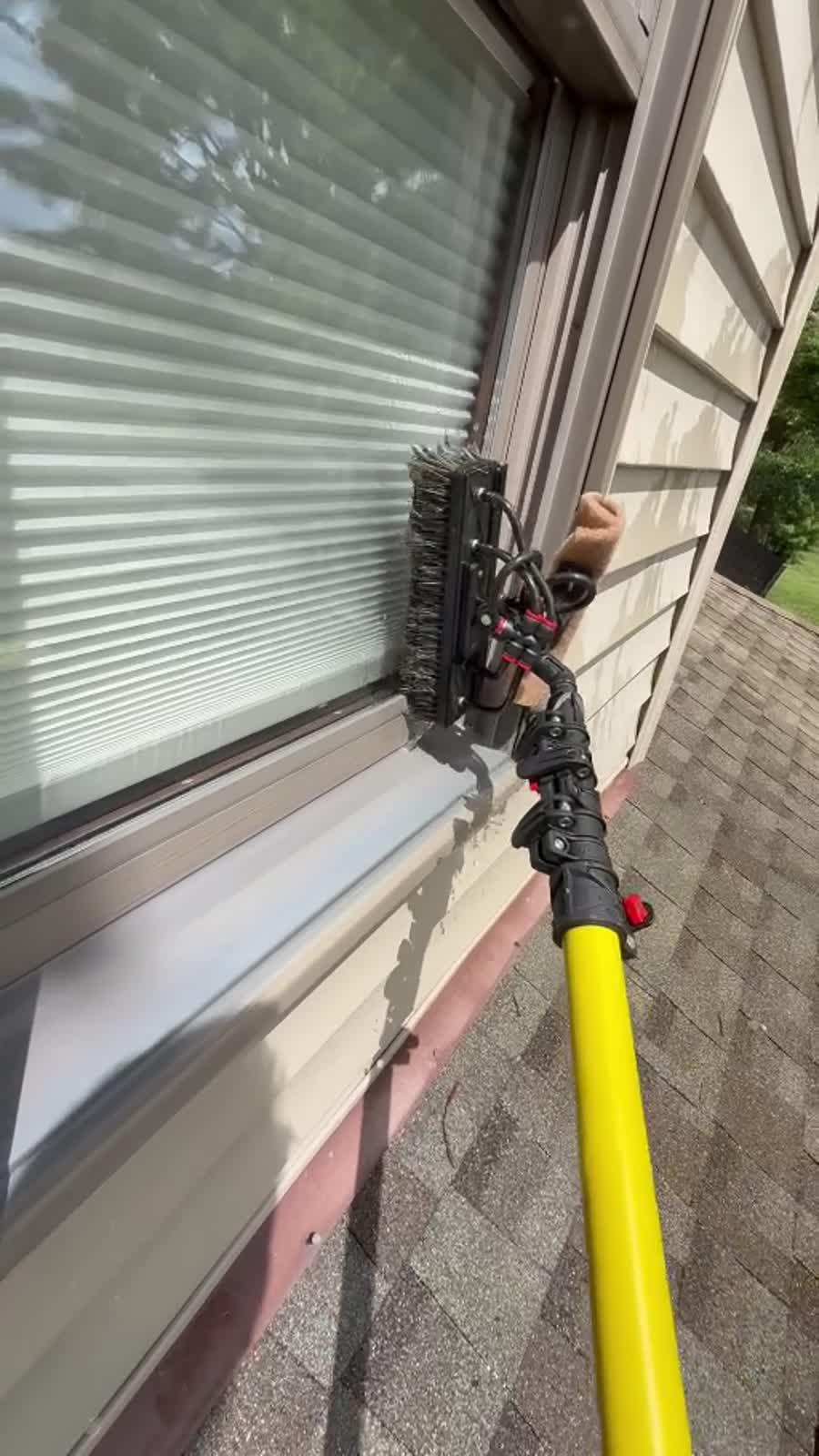 LaWarre pure-water brush cleaning an exterior window